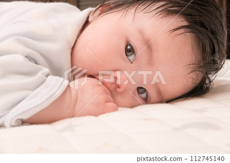 [Baby sucking thumb, lie face down] 112745140