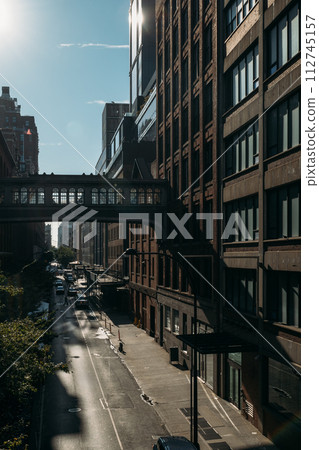 Shadows and Light Play on New York Street Lined with Buildings Shadows and Light Play on New York Street Lined with Buildings 112745157