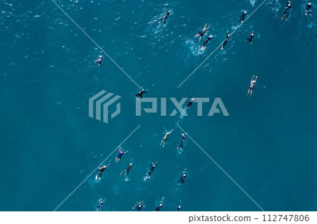 Overhead view of triathlon swimmers during competition 112747806