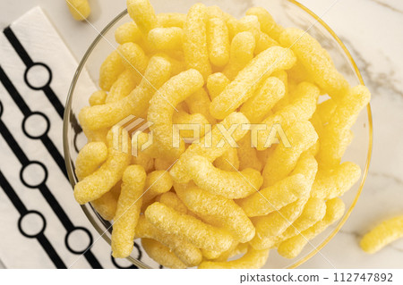 Corn sticks in bowl on table still life. Top view 112747892
