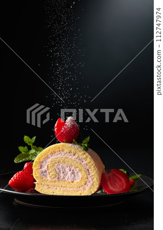 Delicious strawberry biscuit cake sprinkled with sugar powder. Delicious strawberry biscuit cake sprinkled with sugar powder. 112747974