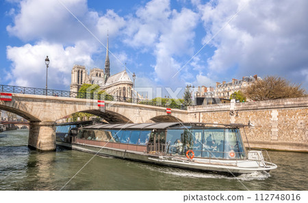 Paris, Notre Dame cathedral with boat on Seine in France 112748016