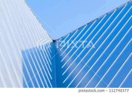 New roof corner made of stainless steel plates, abstract photo 112748377
