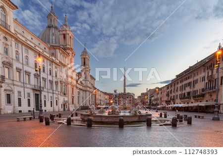 The famous fountains with tritons in Piazza Navona in Rome at dawn. The famous fountains with tritons in Piazza Navona in Rome at dawn. 112748393