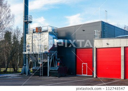 New modern wood chip biofuel boiler house for increased heat energy production efficiency in action 112748547