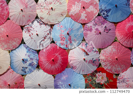 An unfolded Japanese umbrella photographed to fill the entire screen An unfolded Japanese umbrella photographed to fill the entire screen 112749470