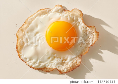 Fried egg close up sunny side up, healthy breakfast Fried egg close up sunny side up, healthy breakfast 112750131