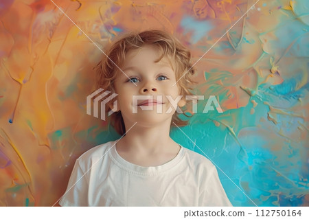 European child boy 4-6 years old in a white T-shirt without a pattern against the background of a colored wall European child boy 4-6 years old in a white T-shirt without a pattern against the background of a colored wall 112750164
