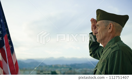 Elderly Man Stand Against American Flag For Veterans Day Holiday 112751407