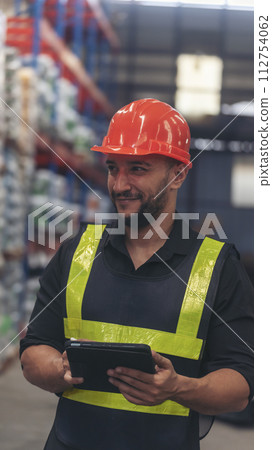 Vertical Hispanic men hands touch smart tablet Warehouse management logistics counting checking products on inventory shelf. Engineer Man hands worker check stock control in distribution checklist Vertical Hispanic men hands touch smart tablet Warehouse management logistics counting checking products on inventory shelf. Engineer Man hands worker check stock control in distribution checklist 112754062