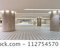Underground space lined with white pillars 112754570