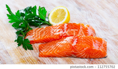 Fresh fillet salmon fish on wooden board Fresh fillet salmon fish on wooden board 112755702