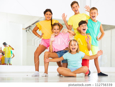 Happy children posing at modern dance class Happy children posing at modern dance class 112756339