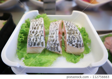 sliced fish , raw fish or cut fish sliced fish , raw fish or cut fish 112756663