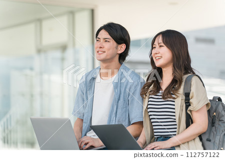 Couple of men and women using laptops (university students/lovers) Couple of men and women using laptops (university students/lovers) 112757122