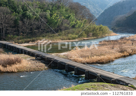 Koiji Bridge, a submerged bridge over the clear Kizugawa River in Kyoto, Minamiyamashiro Village, Kyoto Prefecture Koiji Bridge, a submerged bridge over the clear Kizugawa River in Kyoto, Minamiyamashiro Village, Kyoto Prefecture 112761833