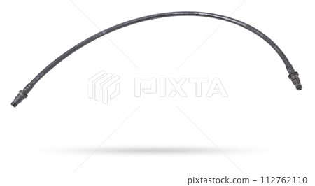 Black plastic hose of the car engine cooling system on a white isolated background in a photo studio for replacement during repair or for a catalog of spare parts for sale on auto disassembly. Black plastic hose of the car engine cooling system on a white isolated background in a photo studio for replacement during repair or for a catalog of spare parts for sale on auto disassembly. 112762110