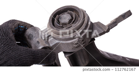 Curved metal chassis arm lever with ball and rubber-metal joint with bushings - silent block on a white isolated background. Detail for suspension repair in a workshop or garage. Curved metal chassis arm lever with ball and rubber-metal joint with bushings - silent block on a white isolated background. Detail for suspension repair in a workshop or garage. 112762167