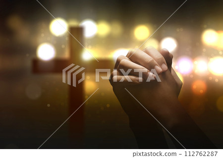Christian man praying with raised hands Christian man praying with raised hands 112762287