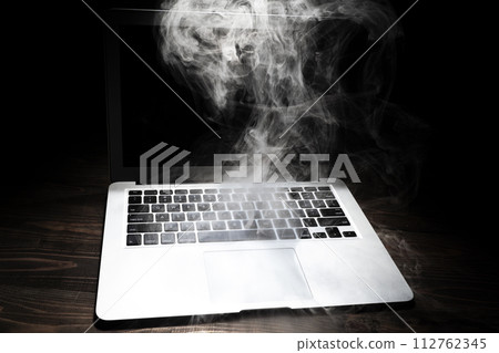 A broken laptop smoked A broken laptop smoked 112762345