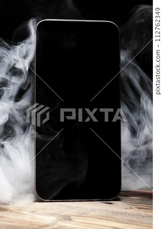 A broken mobile phone smoked 112762349