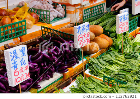 Market vegetables in Hong Kong. Chinese vegetables and Western vegetables are mixed and sold Market vegetables in Hong Kong. Chinese vegetables and Western vegetables are mixed and sold 112762921