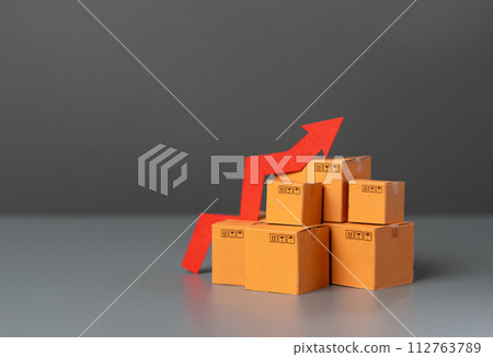Boxes with goods and up arrow. Rising prices. Increase in supplies and production rates. Enhancement in the attractiveness of goods, high demand. Economic GDP acceleration boost. Tax increase. 112763789