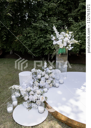 a beautiful arch for a wedding ceremony in a park with chairs a beautiful arch for a wedding ceremony in a park with chairs 112763871