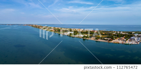 Aerial view of the Lido de Venezia island in Venice, Italy. The island between Venice and Adriatic sea. Aerial view of the Lido de Venezia island in Venice, Italy. The island between Venice and Adriatic sea. 112765472