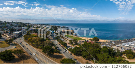 Beautiful aerial view of the Monterey town in California with many yachts docked by the pier. 112766082