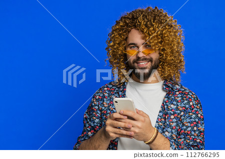 Man use smartphone typing new post on web, browsing searching positive application game feedback 112766295