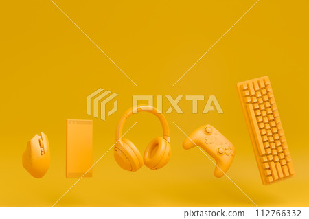 Modern home office setup featuring keyboard, gaming controllers and headphones Modern home office setup featuring keyboard, gaming controllers and headphones 112766332