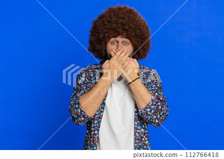 Frightened stylish man closing mouth with hands refusing to tell terrible secret, unbelievable truth Frightened stylish man closing mouth with hands refusing to tell terrible secret, unbelievable truth 112766418