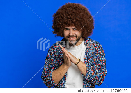 Sneaky cunning young man thinking over devious villain idea, cheats, jokes, pranks, evil plan Sneaky cunning young man thinking over devious villain idea, cheats, jokes, pranks, evil plan 112766491