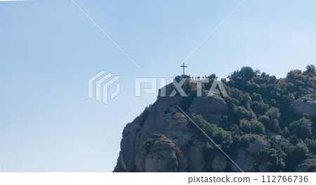 Aerial view of the Benedict church Abbey of Monserrat from Barcelona, Spain. Montserrat Monastery, Santa Maria de Montserrat is a Benedictine abbey located on the mountain of Montserrat Aerial view of the Benedict church Abbey of Monserrat from Barcelona, Spain. Montserrat Monastery, Santa Maria de Montserrat is a Benedictine abbey located on the mountain of Montserrat 112766736