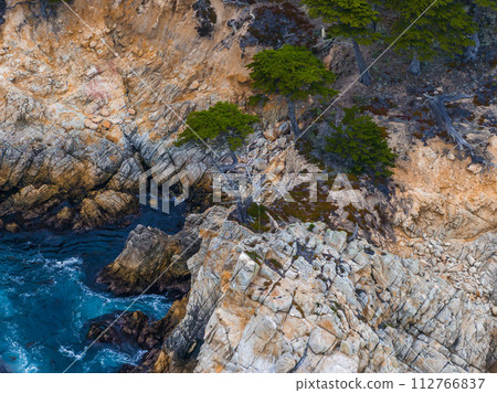 17 mile drive nature. Beautiful aerial view of the Pacific ocean coastline in California, USA. 17 mile drive nature. Beautiful aerial view of the Pacific ocean coastline in California, USA. 112766837