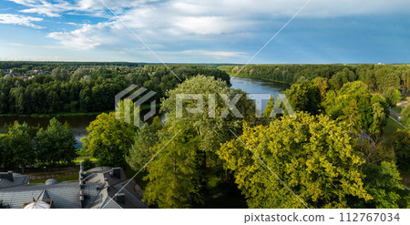 Aerial panoramic view of Lithuanian resort Druskininkai. Druskininkai in autumn colours, drone picture of multi coloured trees in most beautiful city of Druskininkai in Lithuania Aerial panoramic view of Lithuanian resort Druskininkai. Druskininkai in autumn colours, drone picture of multi coloured trees in most beautiful city of Druskininkai in Lithuania 112767034