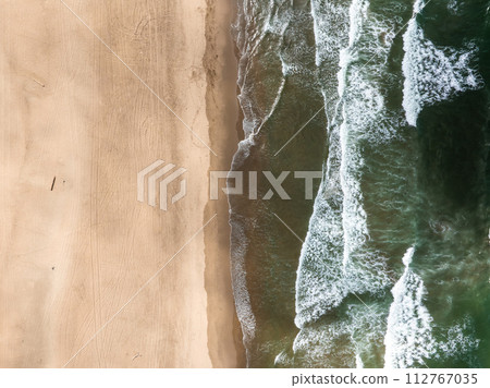 Where the sea meets the land in San Francisco. Ocean Beach is a world renowned surfing beach in the Sunset district of San Francisco. Cliff house building on the cliffs. Where the sea meets the land in San Francisco. Ocean Beach is a world renowned surfing beach in the Sunset district of San Francisco. Cliff house building on the cliffs. 112767035