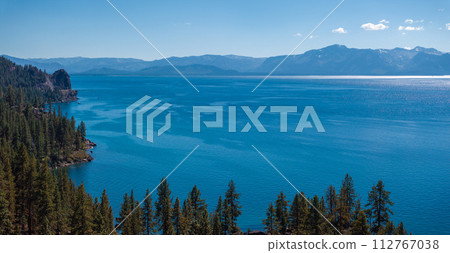 Beautiful aerial view of the Tahoe lake from above in California, USA. Wild forests, fresh air and mountains of California. Beautiful aerial view of the Tahoe lake from above in California, USA. Wild forests, fresh air and mountains of California. 112767038