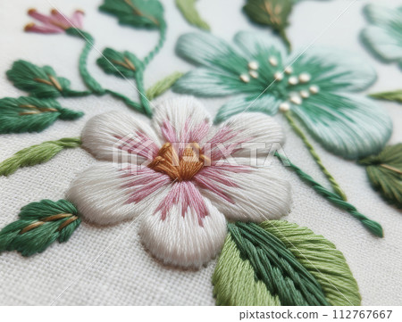 AI-generated content. Close-up of a colorful embroidered flower with detailed stitches on fabric 112767667