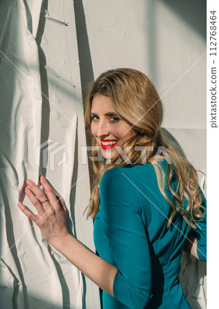 portrait of beautiful woman in dress 112768464