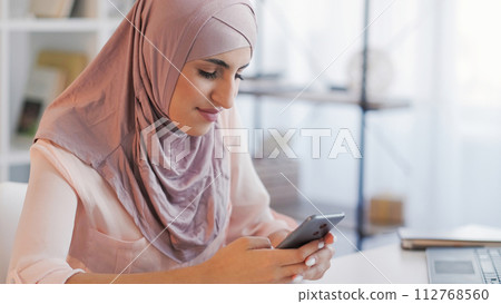 Mobile chatting digital communication woman home Mobile chatting digital communication woman home 112768560