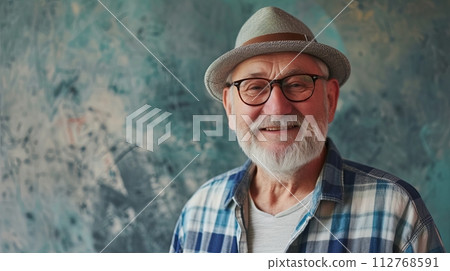 stylish Senior man in the hat smiling positive emotions on pastel background with place for text 112768591