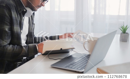 Analysis report man writing document office laptop 112768678