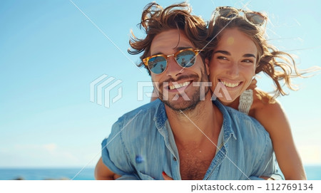 AI-generated content. a man is giving a woman a piggyback ride on the beach 112769134