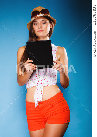 girl using tablet computer e-book reader. girl using tablet computer e-book reader. 112769835