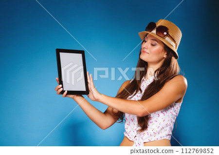 Girl showing blank copy space screen of tablet touchpad 112769852