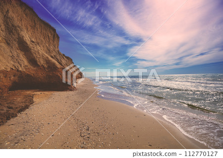 Seascape with a steep clay shore Seascape with a steep clay shore 112770127