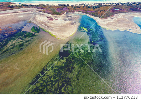 Top view of the estuary shore. Land texture. Abstract nature background Top view of the estuary shore. Land texture. Abstract nature background 112770218