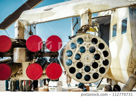 Missile launcher under wing of military helicopter 112770731